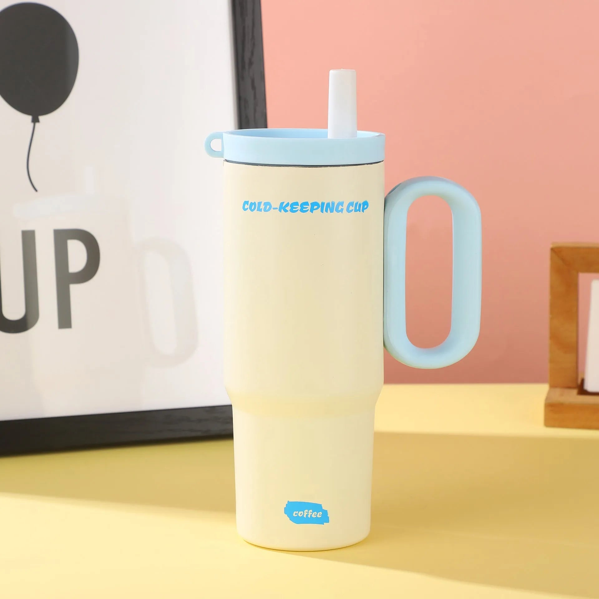 Insulated straw cup with handle showing 710ml capacity and leak-proof lid in assorted colours