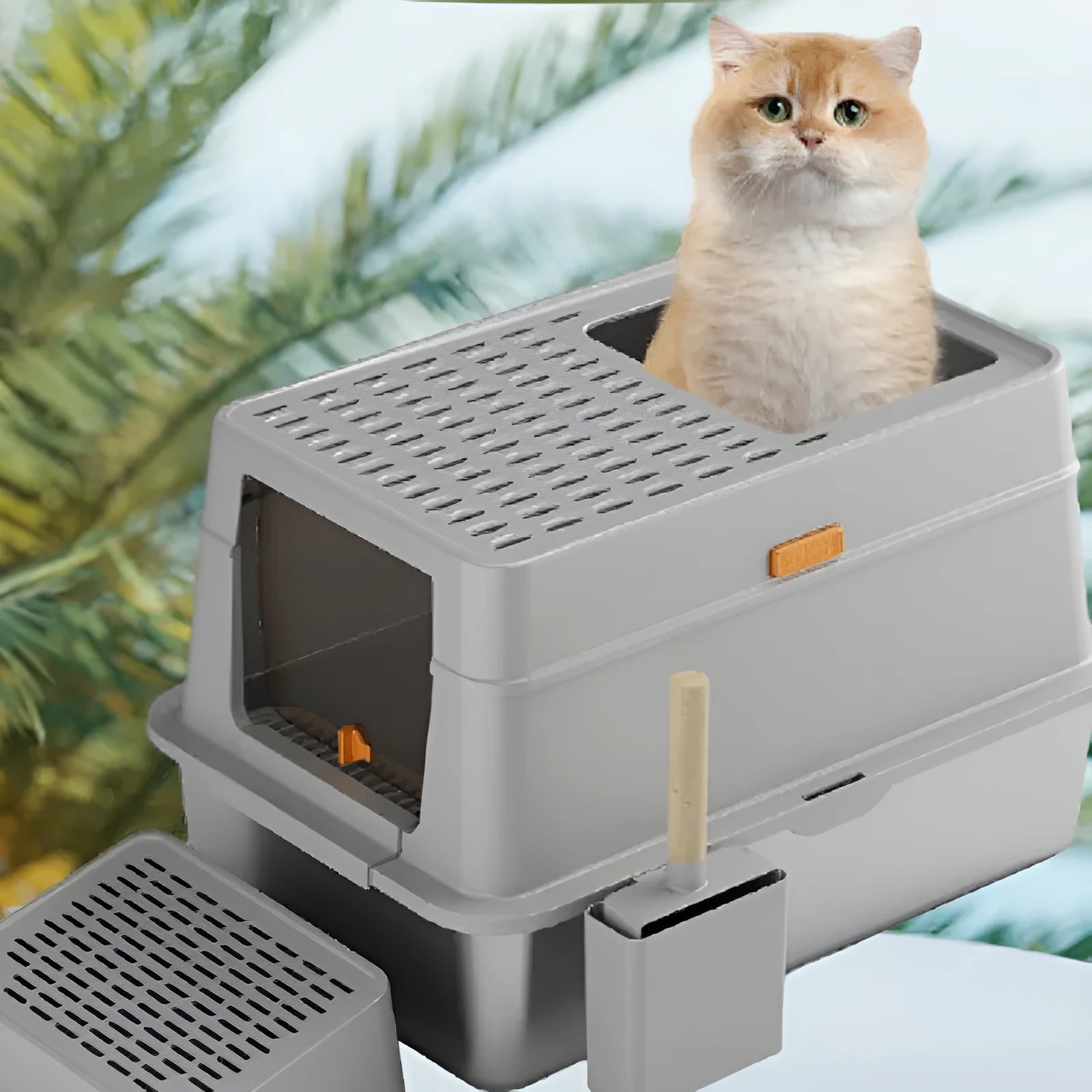 Grey enclosed cat litter box with a foot pedal and stainless steel pan inside