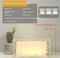 Geometric acrylic ice cube night light with colour changing LEDs on bedside table