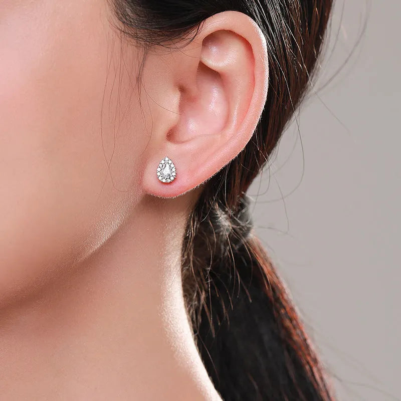 Women's silver water drop ear studs with diamond treatment and 925 sterling silver construction