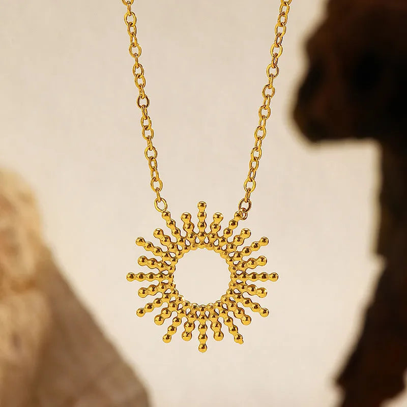 Gold sunflower geometric jewellery set with necklace and bracelet on stainless steel