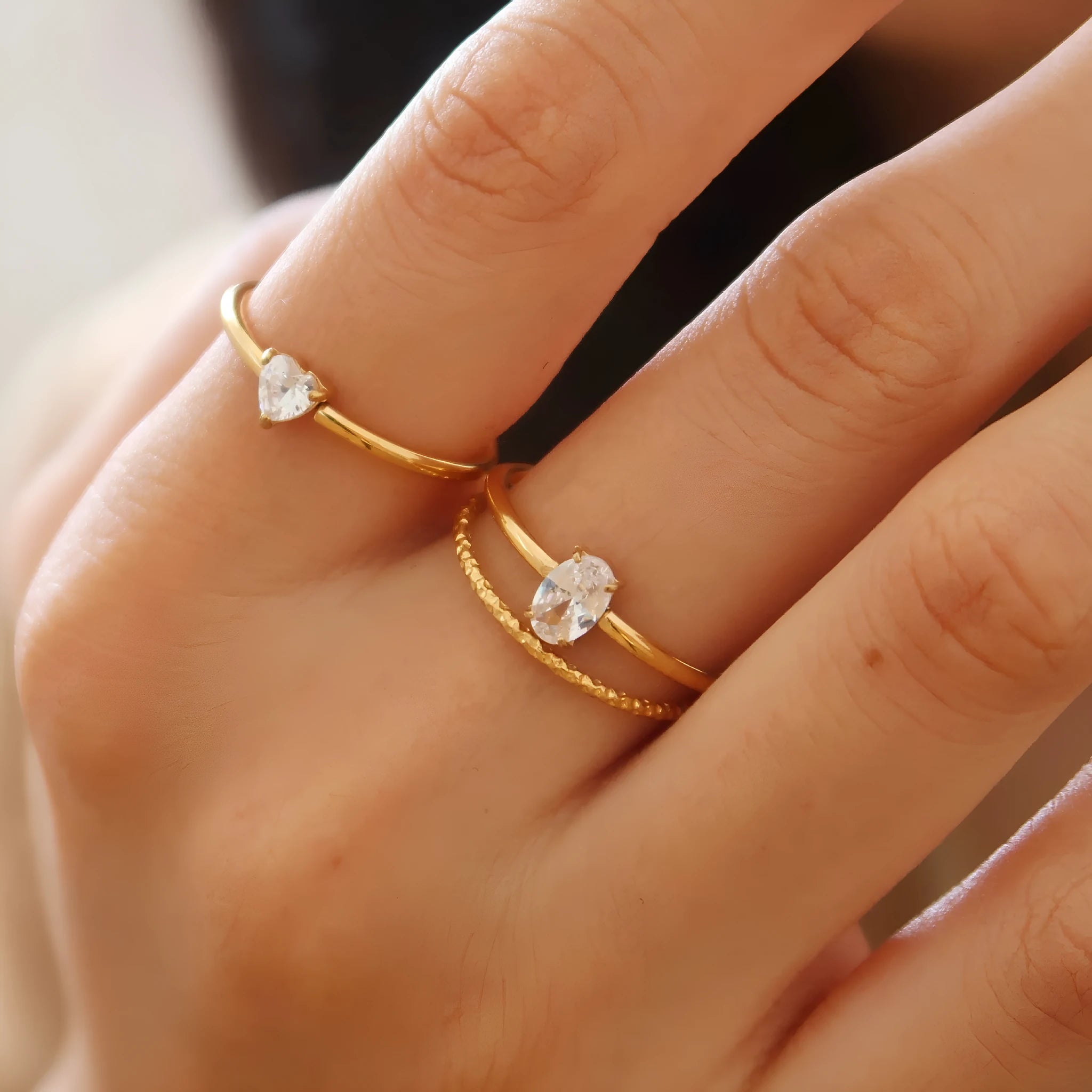 Golden electroplated stainless steel ring showing love heart and oval shapes in sizes no.5 to no.8