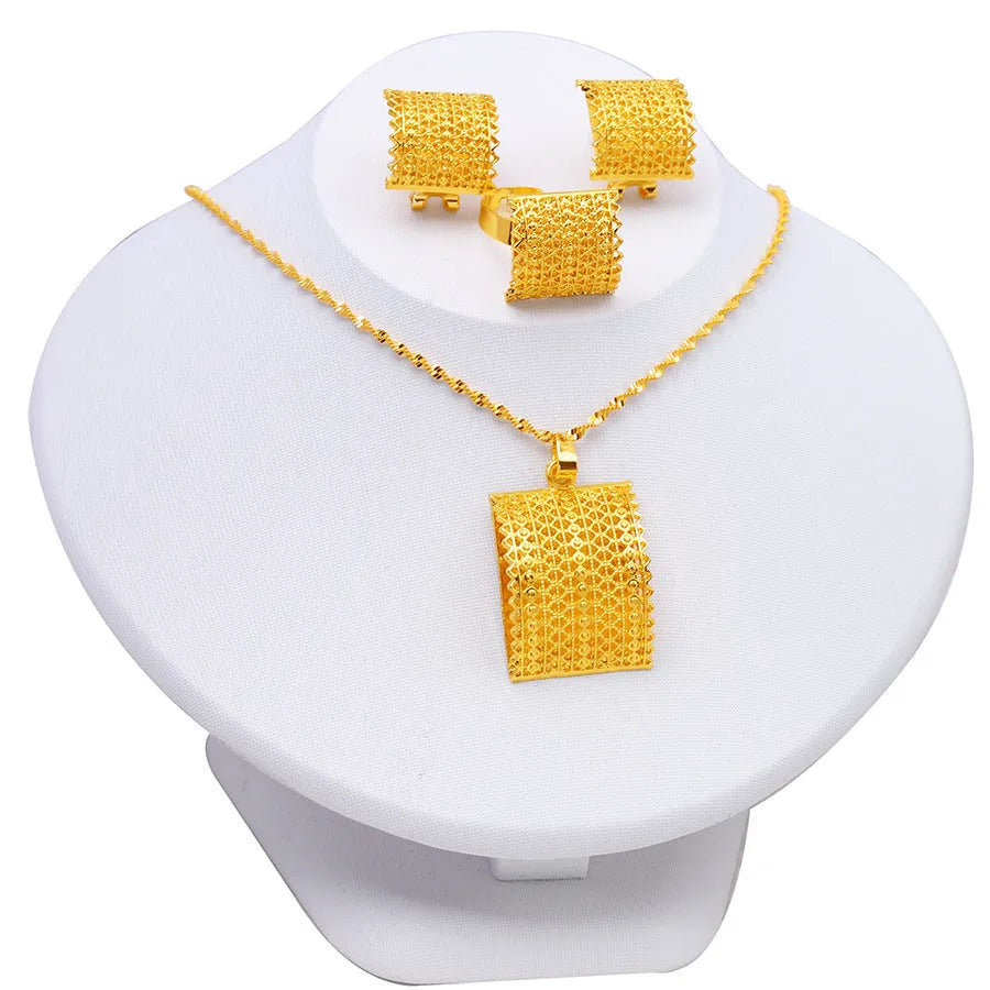 Golden copper bridal jewellery set showing necklace, earrings and ring for wedding