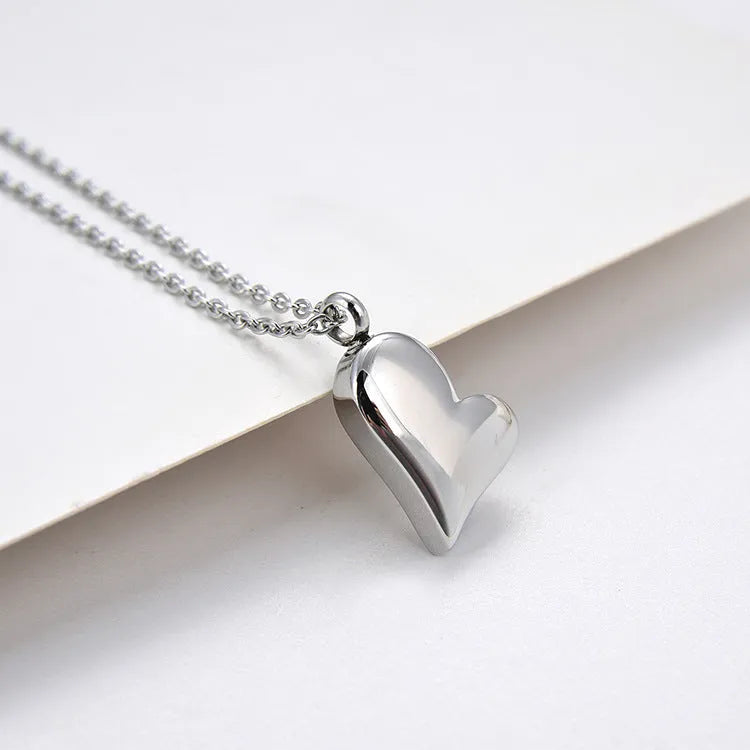 Silver stainless steel curved peach heart pendant necklace with adjustable chain length