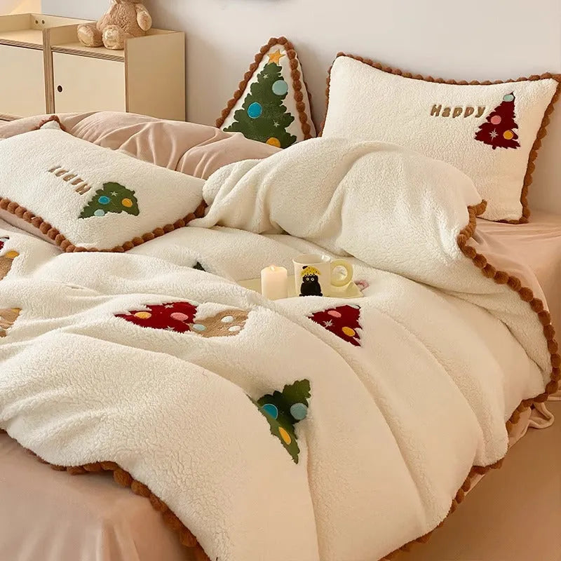 Bright yellow fleece-lined four-piece bedding set with cartoon Christmas tree pattern, shown on a bed.