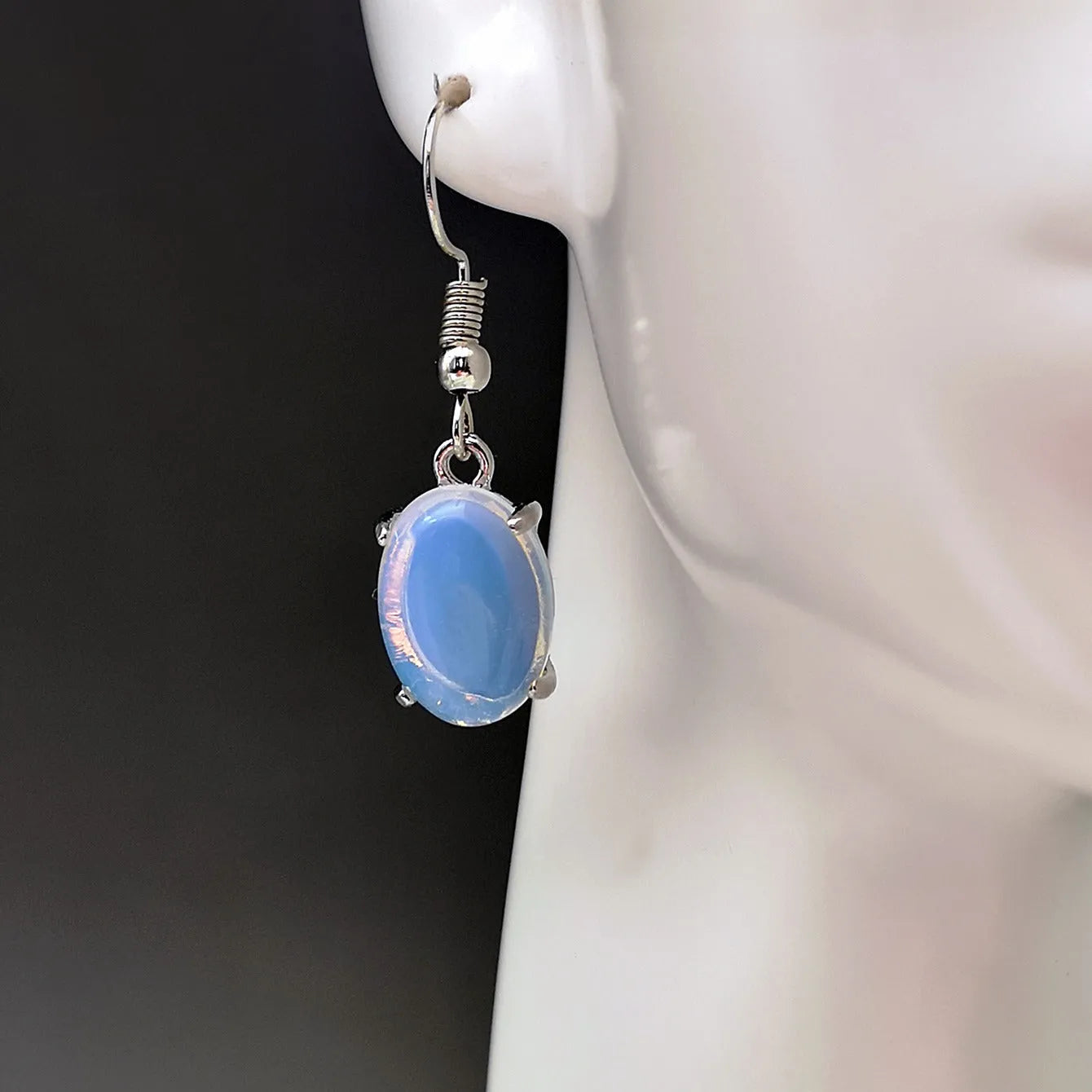 Moonlight white opal earrings with retro cross design and drop shape featuring ellipse elements