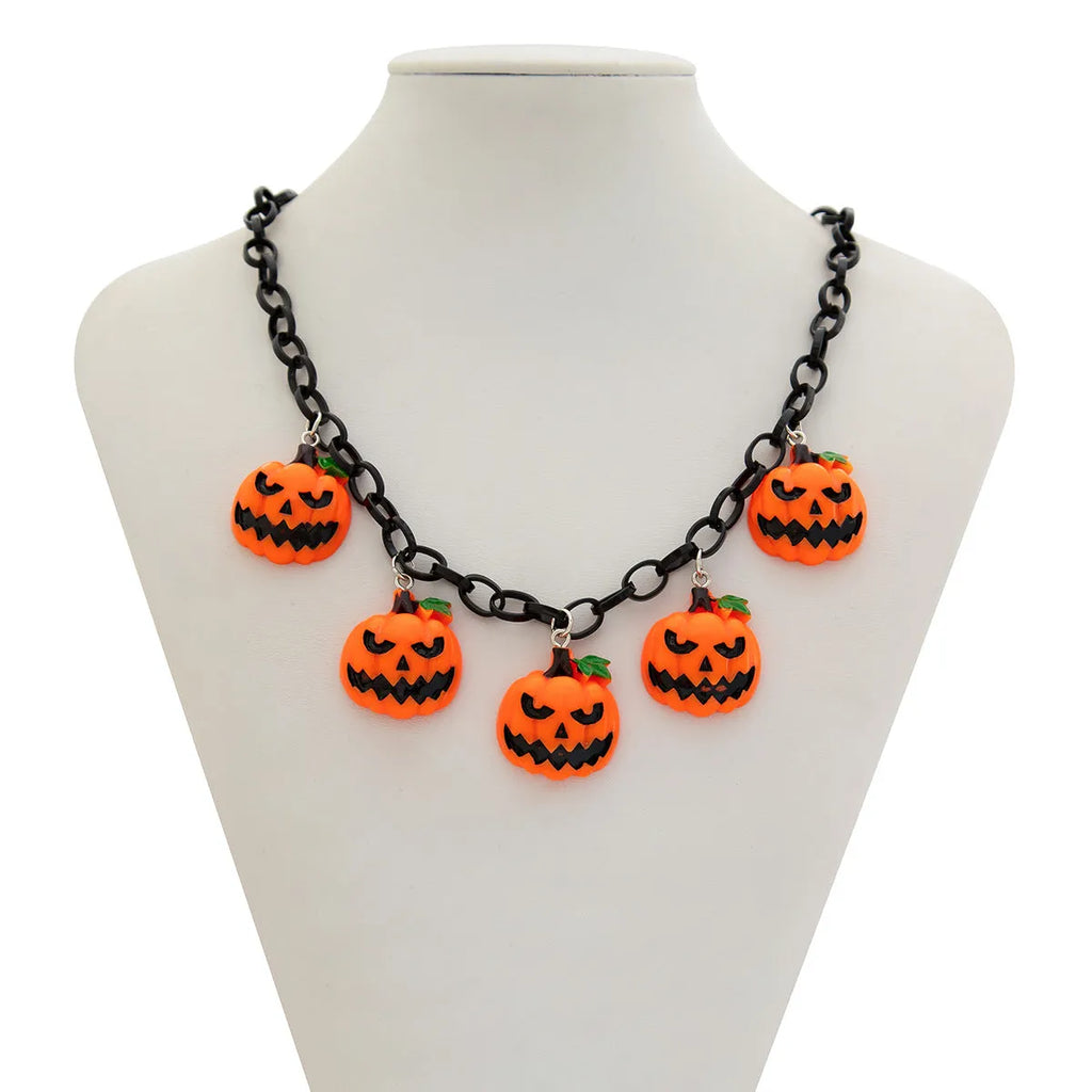 Halloween necklace with a colourful acrylic ghost and pumpkin cartoon pendant on a chain.