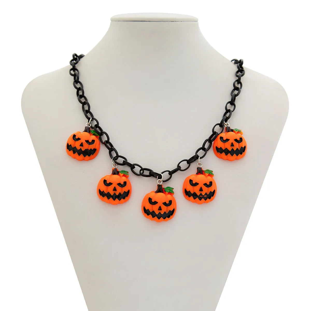Halloween necklace with a colourful acrylic ghost and pumpkin cartoon pendant on a chain.