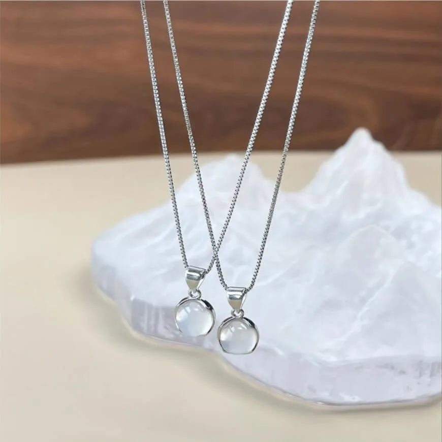 Korean-style oval artificial crystal pendant necklace on an adjustable box chain.