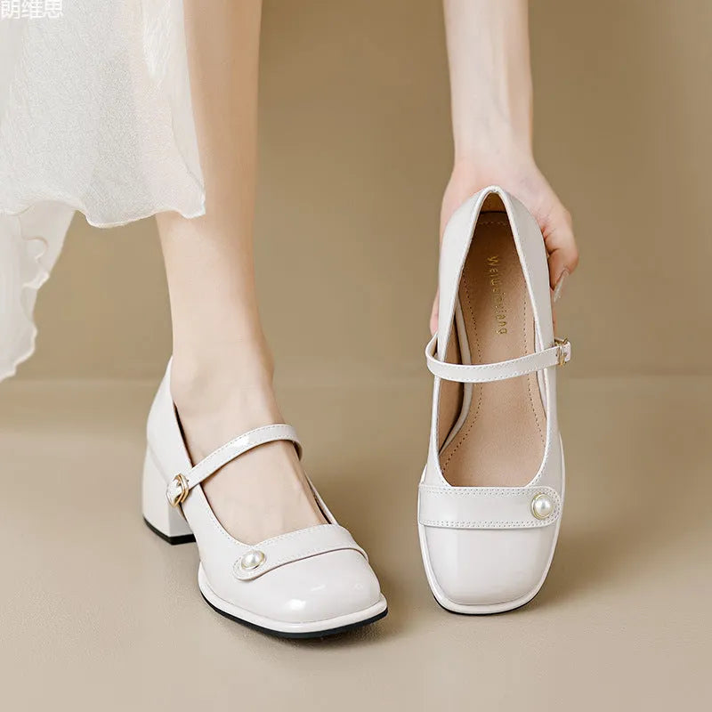 Women's apricot patent leather pumps with chunky heel and square toe, showing buckle ankle strap