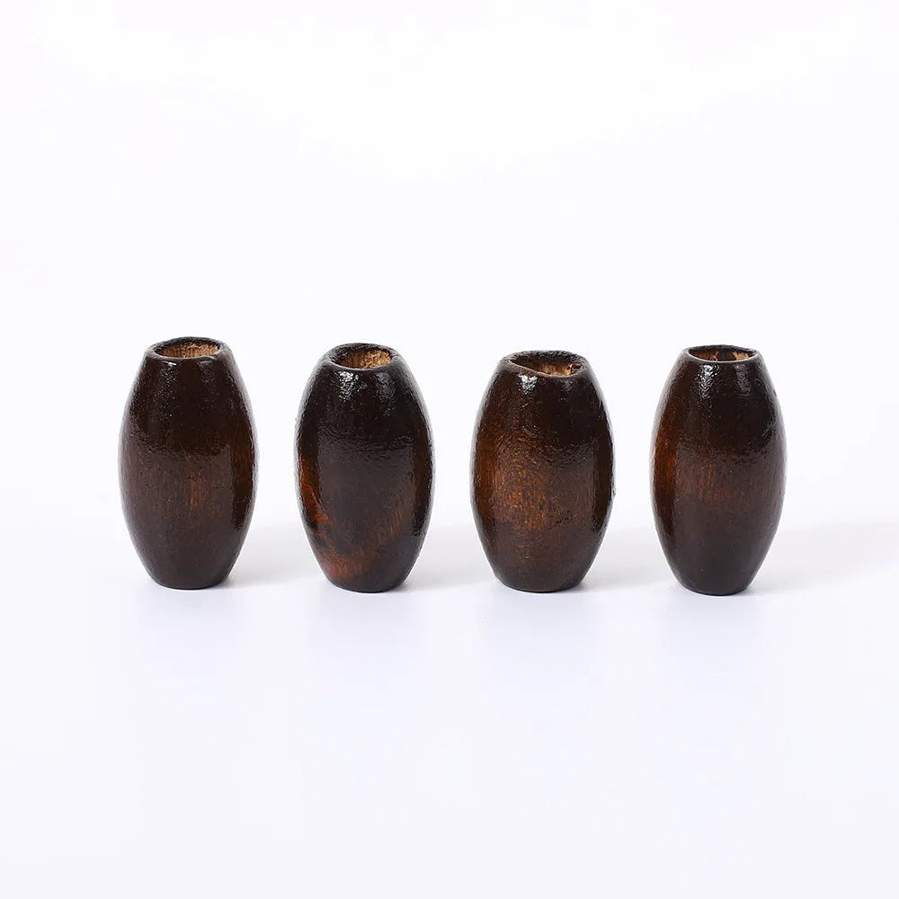 Oval wooden bead with M-shaped raised profile in dark coffee colour, 25mm size with visible centre hole