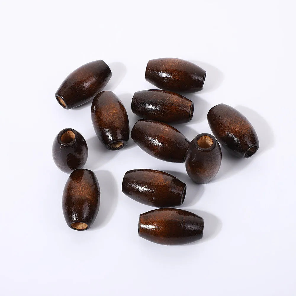 Oval wooden bead with M-shaped raised profile in dark coffee colour, 25mm size with visible centre hole