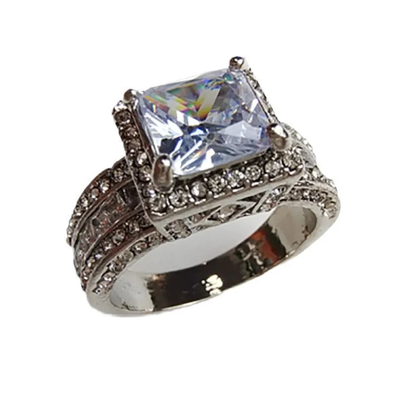 Geometric style women's alloy ring in gold or white electroplated finish on a UK size chart.