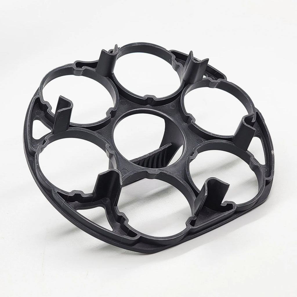 Black modern plastic egg holder rack on a kitchen surface.
