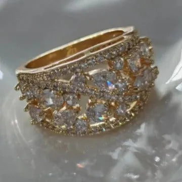 Women's hollow round copper fashion ring shown in gold and platinum with white diamond or blue sapphire accents.
