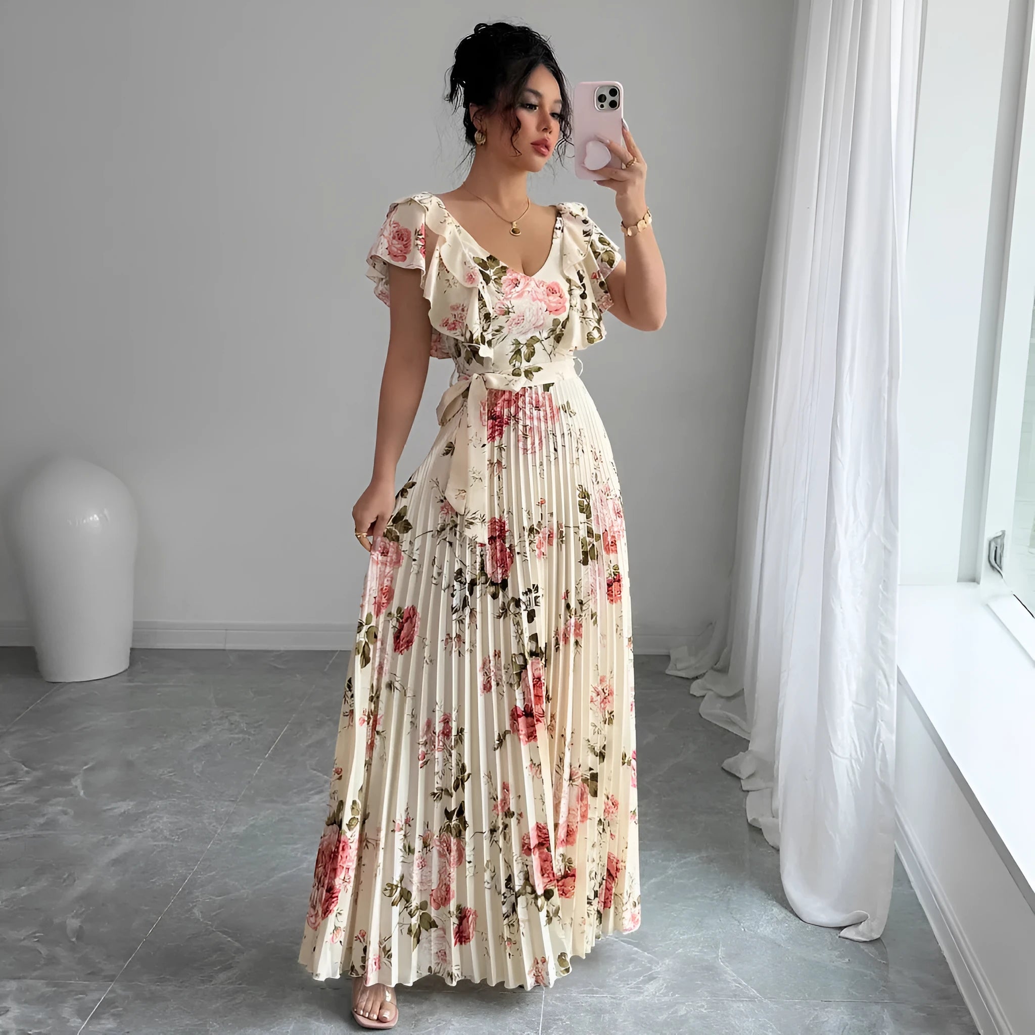 Apricot-coloured women's floral print dress with a V-neck, ruffled short sleeves, and an oversized pleated skirt.