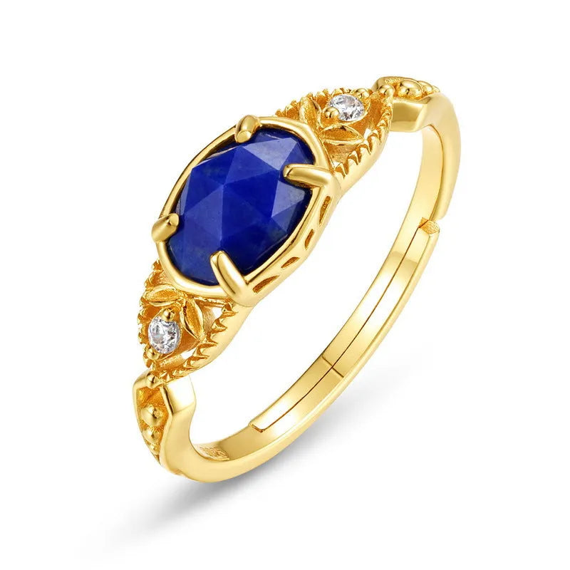 Geometric oval silver-tone alloy ring with a deep blue lapis lazuli centre stone.