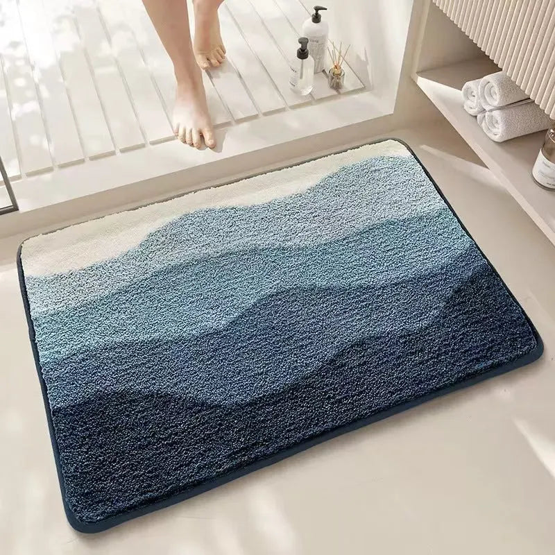 Square imitation cashmere carpet mat with Rainbow pattern and plastic dirt-resistant bottom.