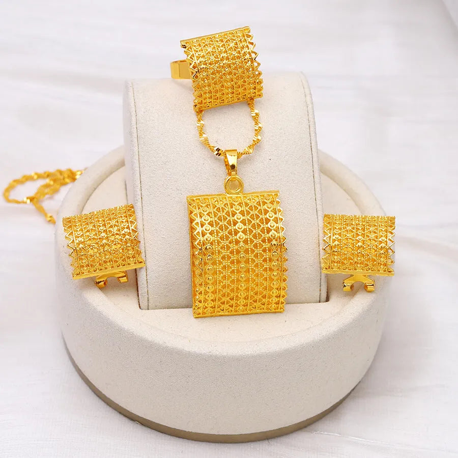 Golden copper bridal jewellery set showing necklace, earrings and ring for wedding