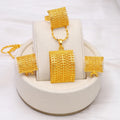Golden copper bridal jewellery set showing necklace, earrings and ring for wedding
