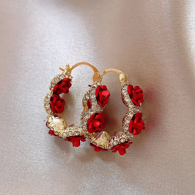 Red floral alloy ear clips with rose design and clip fastening