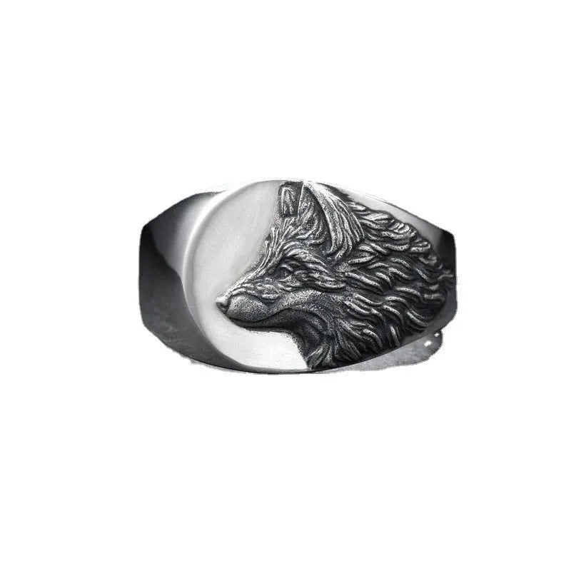 Silver geometric wolf head men's ring made from alloy metal on a grey background.