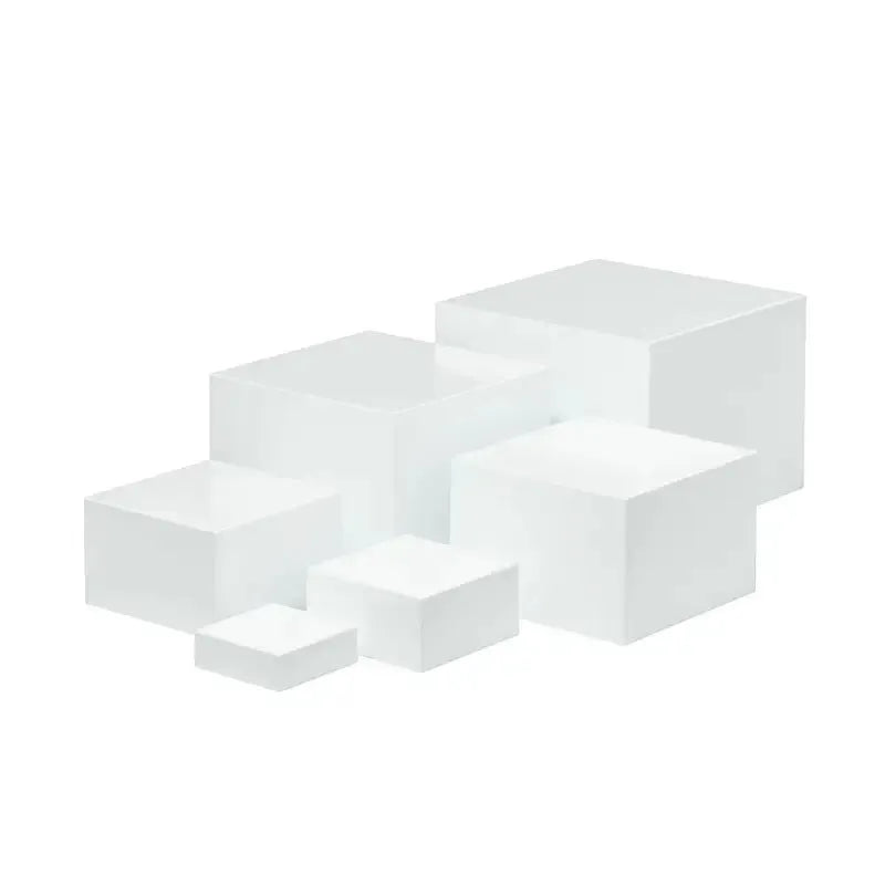 White plastic suit cube dessert display stand 6-piece set arranged in tiered configuration on tabletop
