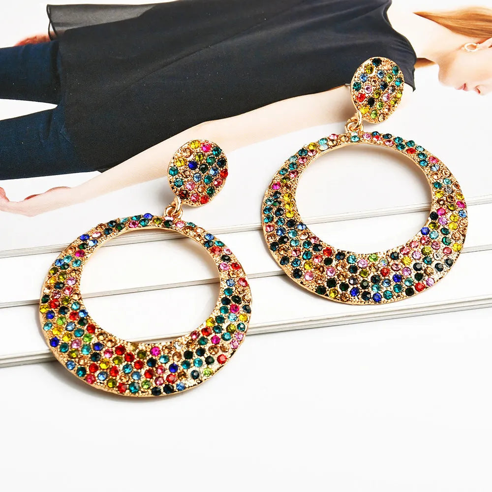 Large round pendant earrings with colourful diamond details on alloy metal, cartoon style