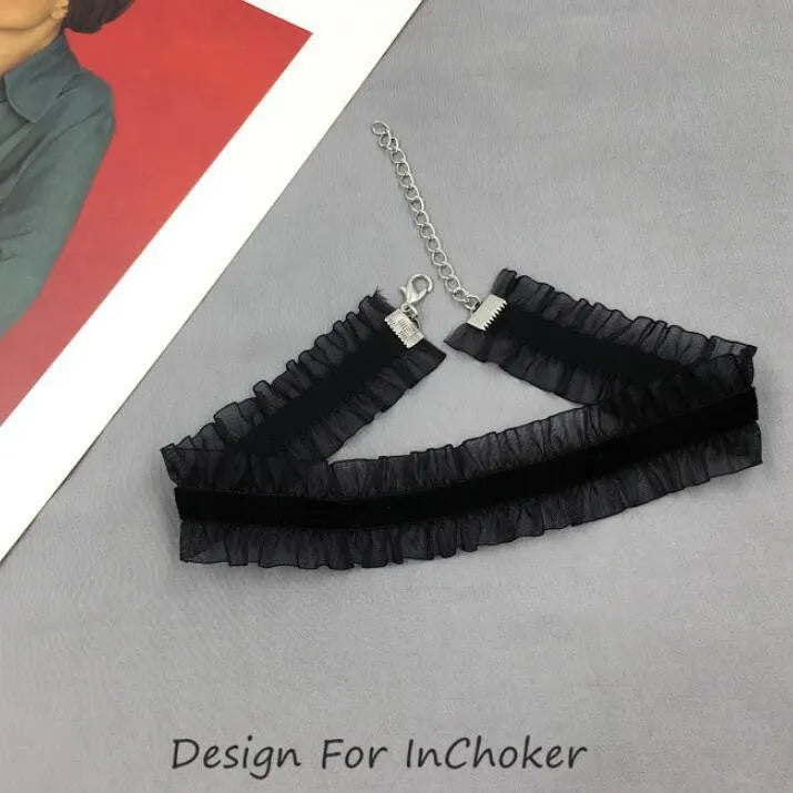 Close-up of a velvet-ruffled floral alloy necklace on a snake bones chain in light coffee colour.