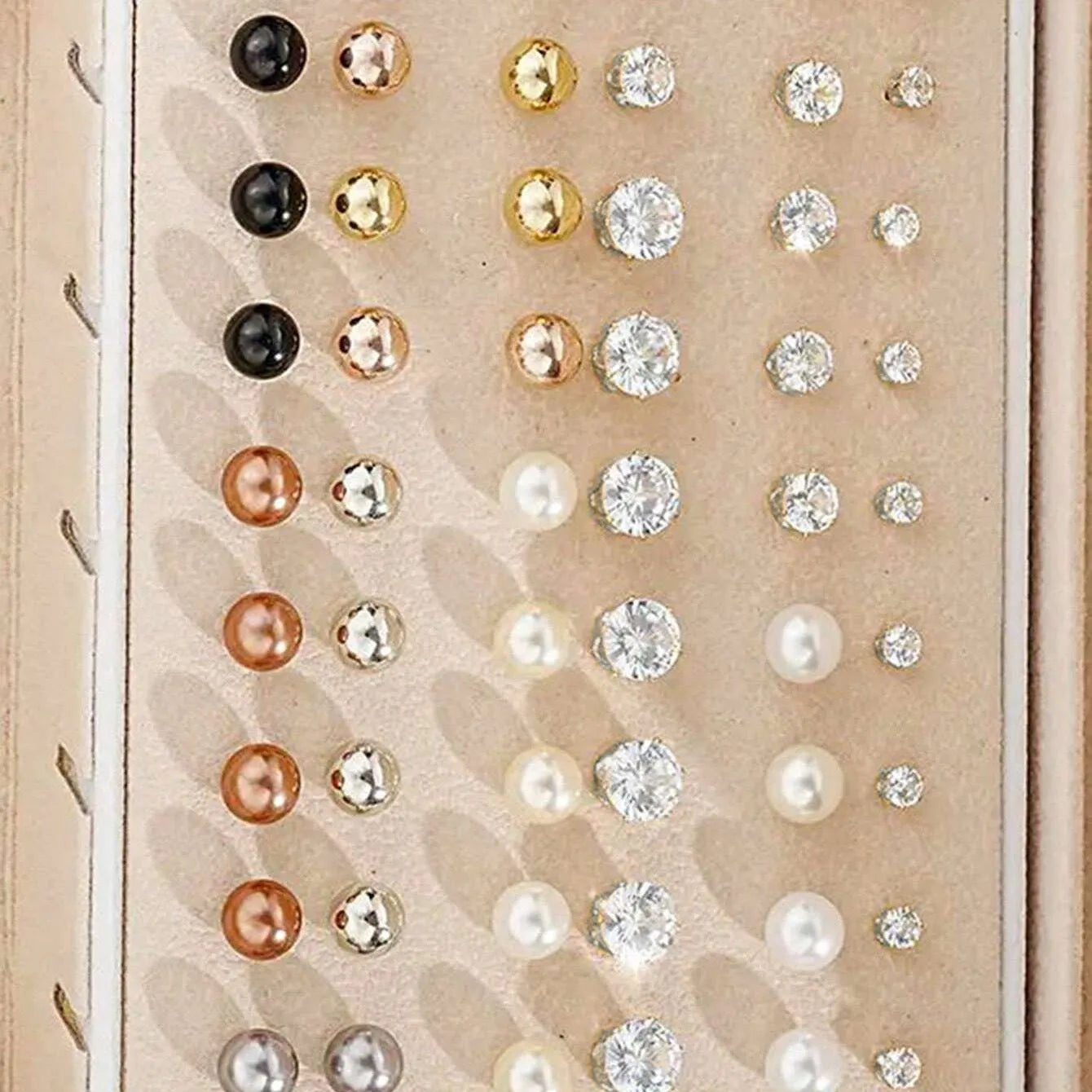 108-piece gold and yellow geometric round pearl earrings multipack on a flat surface.