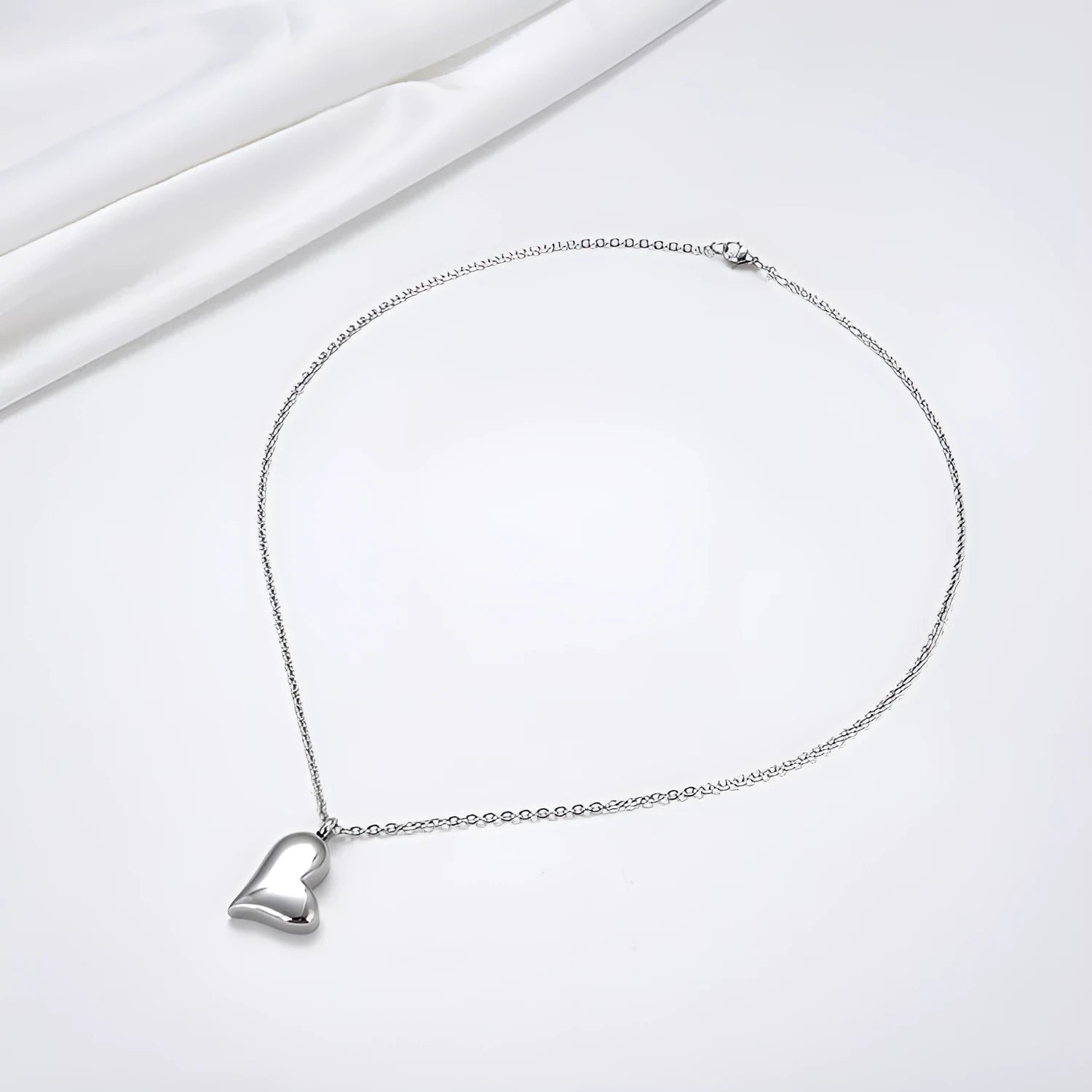 Silver stainless steel curved peach heart pendant necklace with adjustable chain length