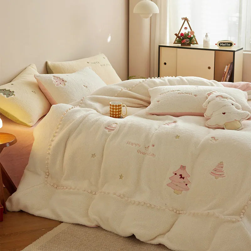 Princess style milk fibre bedding set with green Christmas tree print on a bed, showing quilt cover and pillowcases.