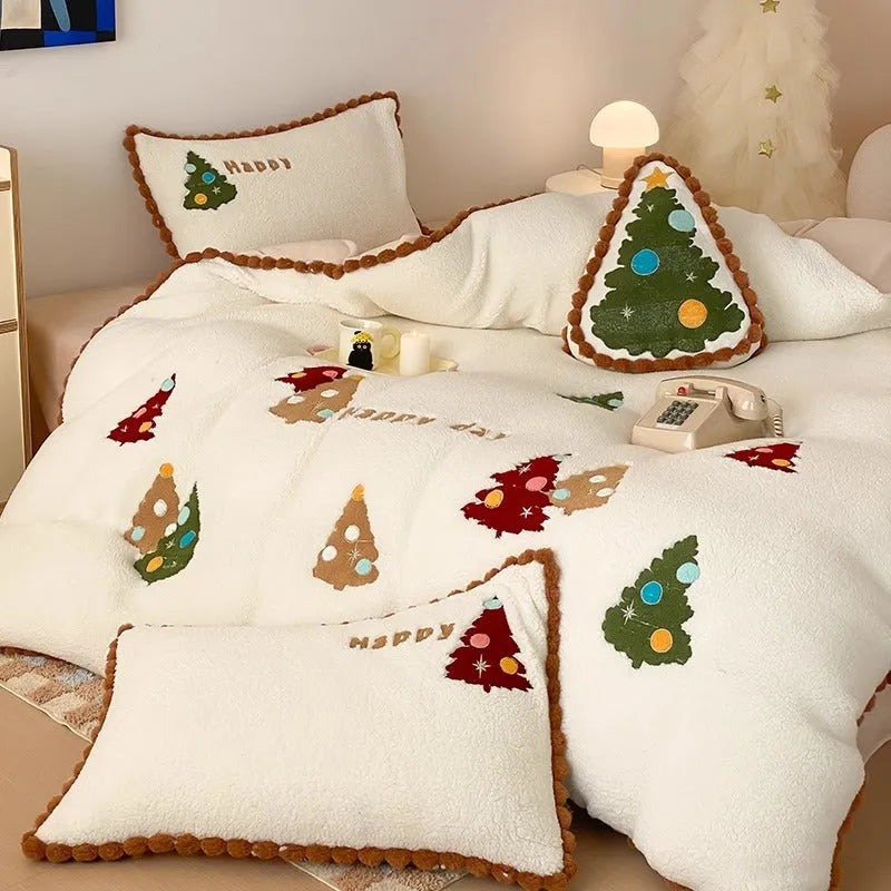 Bright yellow fleece-lined four-piece bedding set with cartoon Christmas tree pattern, shown on a bed.