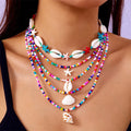 Five women's necklaces with starfish shell conch bead designs in blue and multicolour with alloy pendants