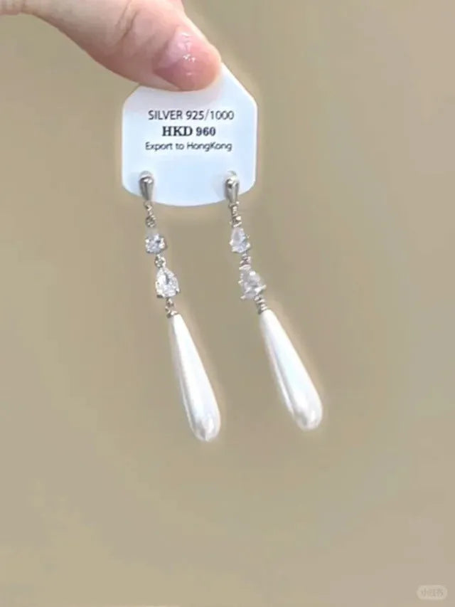 Geometric-shaped women's earrings with heart and star rhinestones and long tassel drops.