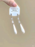 Geometric-shaped women's earrings with heart and star rhinestones and long tassel drops.
