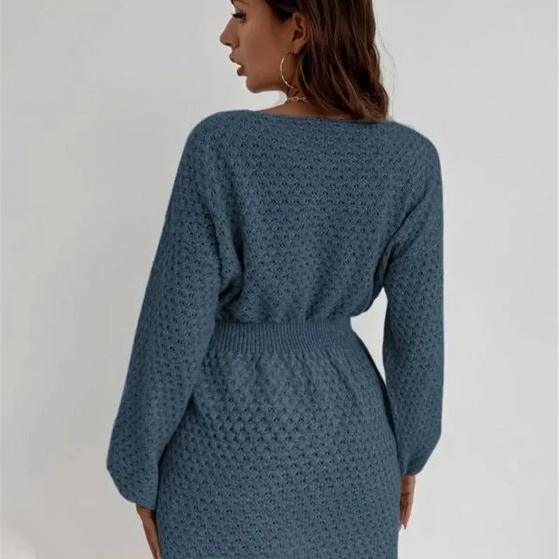 Blue knitted dress with French loose round neck, fitted waist, and hand-crocheted flower decorations