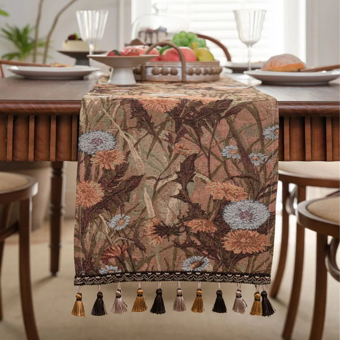 American-style beige jacquard table runner with floral pattern and long tassels on a dining table.