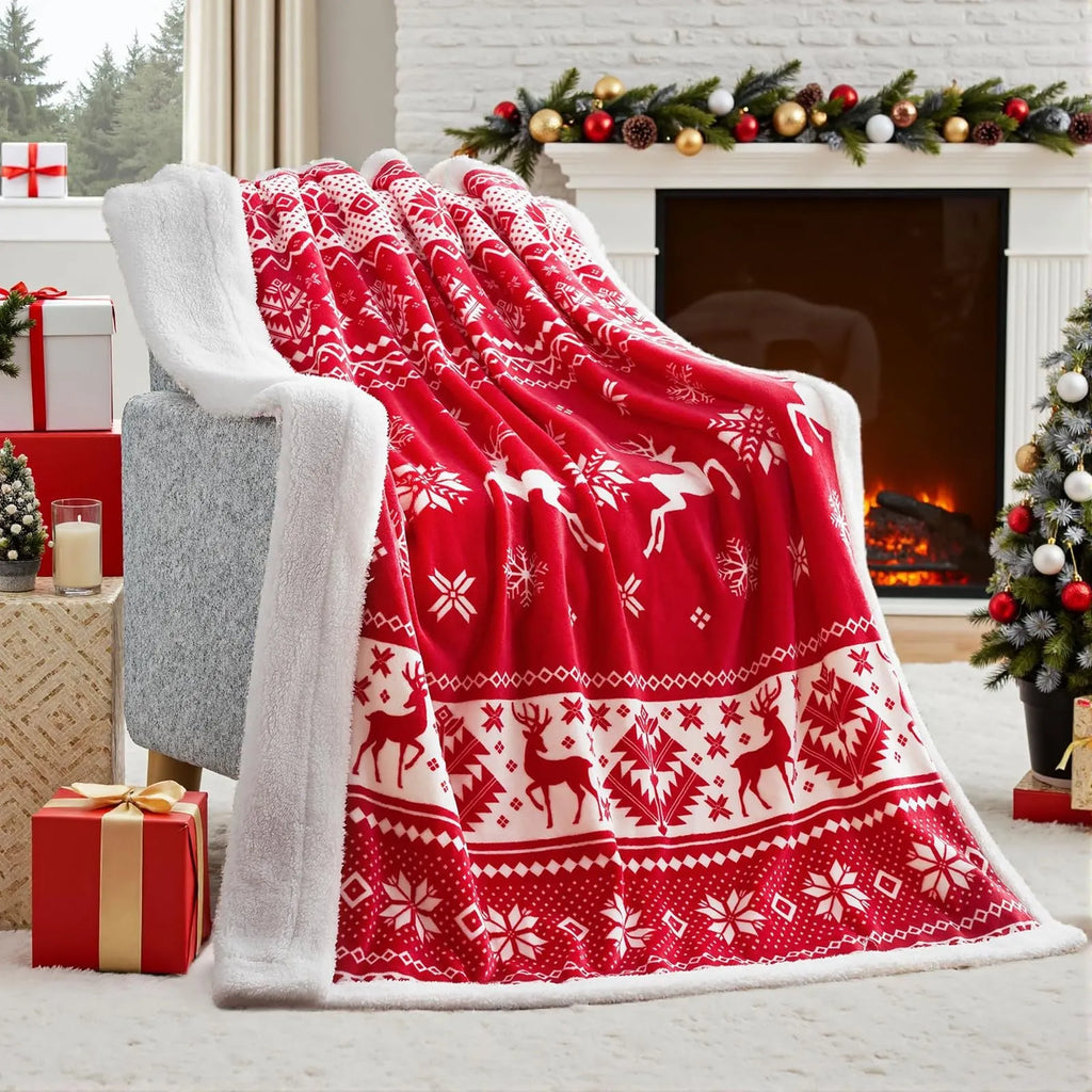 Soft plush flannel Christmas blanket in a choice of colours and sizes on a sofa.