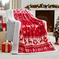 Soft plush flannel Christmas blanket in a choice of colours and sizes on a sofa.