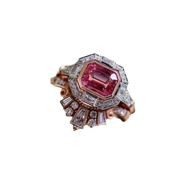 Rose gold geometric alloy women's ring with a retro ruby style on a grey background.