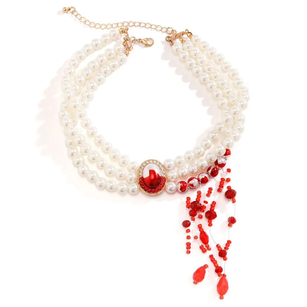 Halloween gothic jewellery set with pearl collar necklace, gold bracelet, and stud earrings on a dark background.