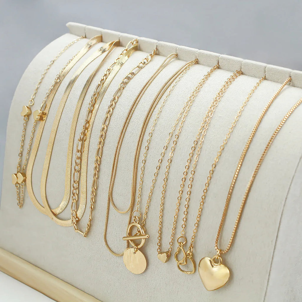 10-piece gold women's necklace set with adjustable snake bone chain and alloy pendants