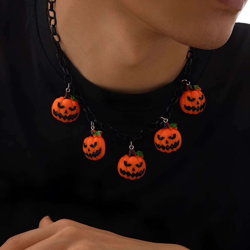 Halloween necklace with a colourful acrylic ghost and pumpkin cartoon pendant on a chain.