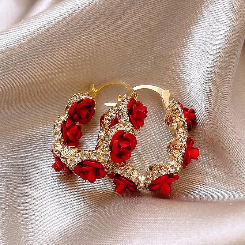 Red floral alloy ear clips with rose design and clip fastening