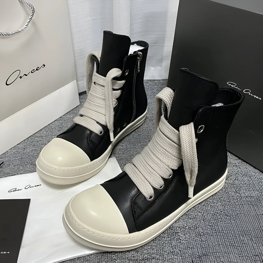 Black high-top leather casual sneakers with a side zipper and a round toe on a rubber sole.