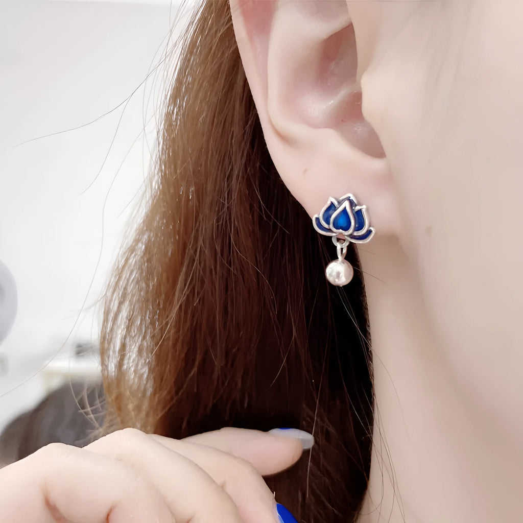 Blue lotus earrings with flower-shaped studs and artistic lotus seedpod tassel dangle