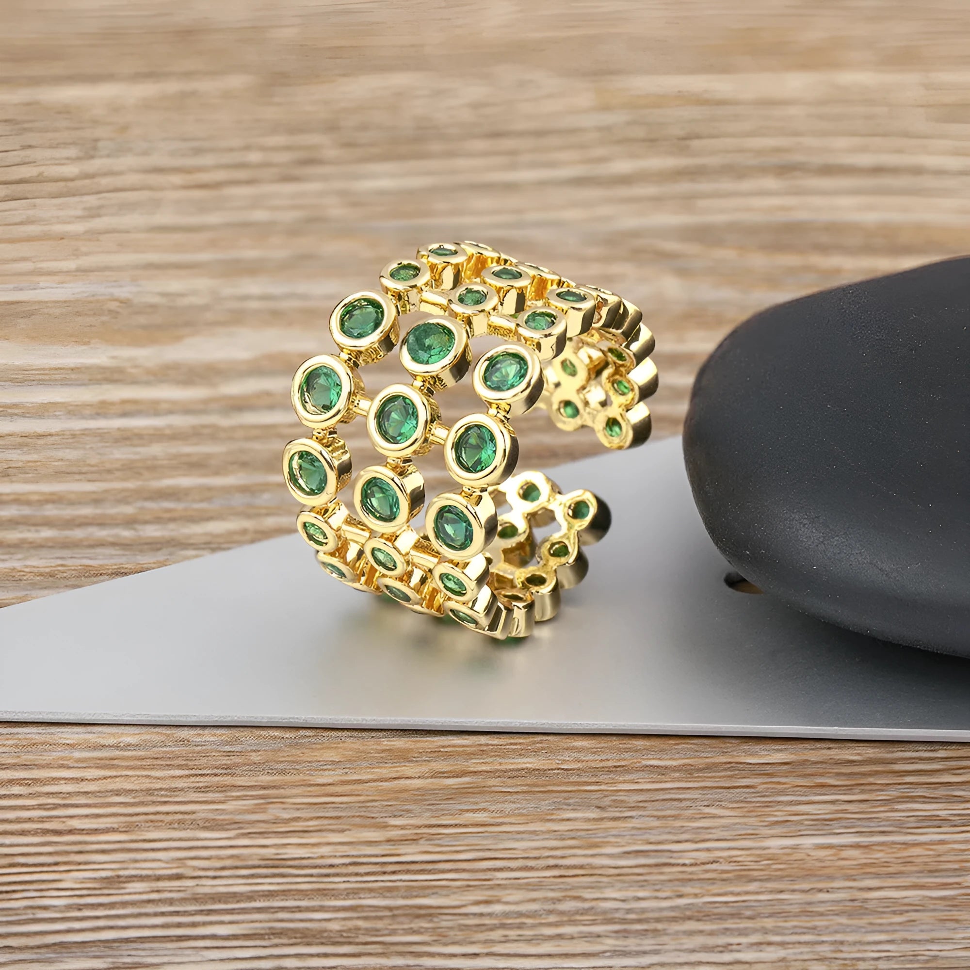 Copper wide band ring with 18K gold plating, green accents, and zircon stones