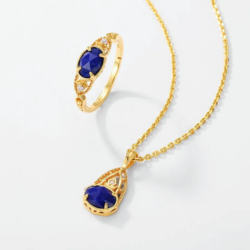 Geometric oval silver-tone alloy ring with a deep blue lapis lazuli centre stone.