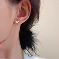 Women's fishtail design earrings in electroplated white gold or yellow gold colours